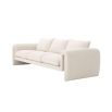 A unique and distinctive sofa by Eichholtz with a bouclé cream upholstery and free flowing shape