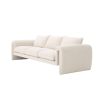 A unique and distinctive sofa by Eichholtz with a bouclé cream upholstery and free flowing shape