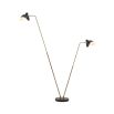 Flexible floor lamp in an antiqued brass finish.