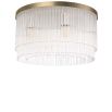Art deco inspired ceiling lamp in a light brass finish.