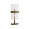 A retro-inspired table lamp with a clear, ribbed glass shade and an antique brass finish 