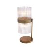 A retro-inspired table lamp with a clear, ribbed glass shade and an antique brass finish 