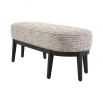 A luxurious bench by Eichholtz with a Mademoiselle beige upholstery and a black finished base