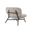 A gorgeous retro inspired chair by Eichholtz upholstered in a stylish Mademoiselle Beige fabric
