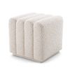 A boucle cream stool with deep channel stitching fit for any modern decor