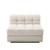 Middle sofa section upholstered in a boucle cream fabric with a black base.