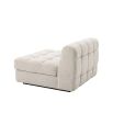 Middle sofa section upholstered in a boucle cream fabric with a black base.