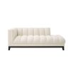 A luxurious left facing sofa from Eichholtz with a beautiful boucle cream upholstery and contrasting black base