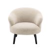 A gorgeous boucle armchair in a brisbane cream finish and black legs