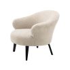 A gorgeous boucle armchair in a brisbane cream finish and black legs