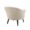 A gorgeous boucle armchair in a brisbane cream finish and black legs
