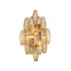 A statement wall lamp by Eichholtz with diamond-shaped, amber glass tubes and an antique brass finish