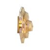 A statement wall lamp by Eichholtz with diamond-shaped, amber glass tubes and an antique brass finish