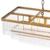A captivating, Art Deco inspired chandelier by Eichholtz with three levels of clear glass rods and an antique brass finish