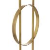 A luxurious floor lamp by Eichholtz with an antique brass base finished with a circular white marble plinth and off-white shade