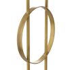 A luxurious floor lamp by Eichholtz with an antique brass base finished with a circular white marble plinth and off-white shade