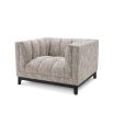 beautifully upholstered beige armchair