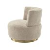 A luxuriously soft curvaceous swivel chair by Eichholtz with a brushed brass swivel base