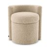 A fluffy stool upholstered in a sand coloured fabric with a curved back.