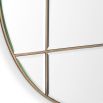 Circular wall mirror with antique brass frame