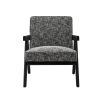 A luxurious chair by Eichholtz with a Cambon Black upholstery and black V-shaped legs