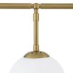 A stylish chandelier by Eichholtz with four white glass globes and an antique brass finish