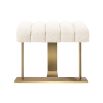A gorgeous stool by Eichholtz with a boucle cream upholstery, deep channelled stitching and a brushed brass frame