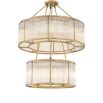 A decadent two-tiered chandelier with panelled glass and brass accents