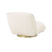 A beautiful, boucle cream upholstered chair by Eichholtz with a brushed brass base 