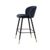 Luxurious blue velvet bar stool with black tapered legs and brass caps