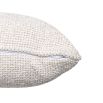 Small off-white cushion with a soft and textured feel.