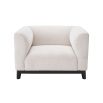 A chic armchair by Eichholtz with a Lyssa Off-White upholstery and black base