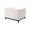 A chic armchair by Eichholtz with a Lyssa Off-White upholstery and black base