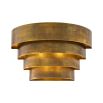 A statement wall lamp by Eichholtz with a vintage brass finish