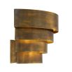 A statement wall lamp by Eichholtz with a vintage brass finish