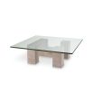 Graceful and sophisticated modern coffee table with glass surface and travertine base