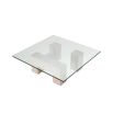 Graceful and sophisticated modern coffee table with glass surface and travertine base