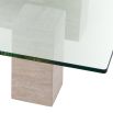 Graceful and sophisticated modern coffee table with glass surface and travertine base