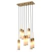 A luxury, statement chandelier by Eichholtz with a sculptural design and an antique brass finish 