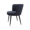 A luxurious dining chair with a dark blue velvet upholstery, swivel seat and gold capped feet