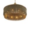 A large, eye-catching chandelier by Eichholtz inspired by the 1920s with four rows of thin chains and an antique brass finish 