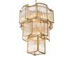 A luxurious chandelier by Eichholtz with a curved antique brass finish and decorative clear glass rods
