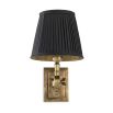 Opulent black and gold wall light with vintage effect