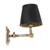 Opulent black and gold wall light with vintage effect