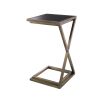 A stylish side table by Eichholtz with a cross-legged frame, vintage brass finish and black glass table top