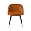 A luxury set of dining chairs with an orange velvet upholstery and golden capped feet