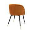 A luxury set of dining chairs with an orange velvet upholstery and golden capped feet