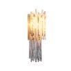 A spectacular wall lamp by Eichholtz featuring smoked glass icicles and a light brushed brass finish