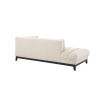 A luxurious lounge sofa by Eichholtz with a bouclé cream upholstery, deep channel stitching and a black base