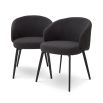 Sleek and elegant black boucle dining chairs